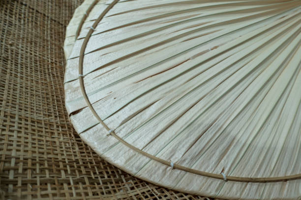 istock Weave fan made of dried palm leaf plant 1333590372