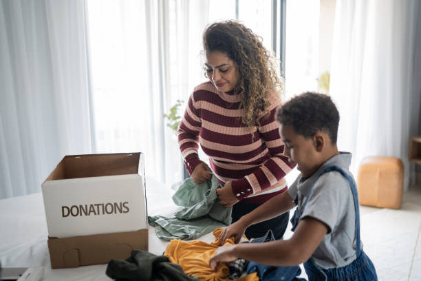 istock Mother and son sorting clothes for donation at home 1333590606