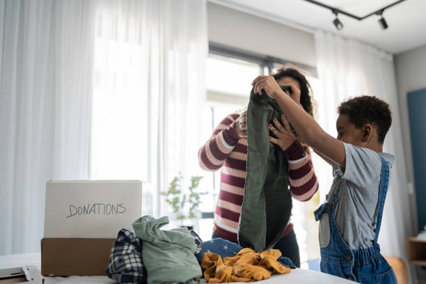 istock Mother and son sorting clothes for donation at home 1333590681