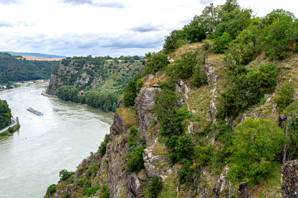istock Rock formations on the edge of a cliff above a river in West Germany. 1333590947