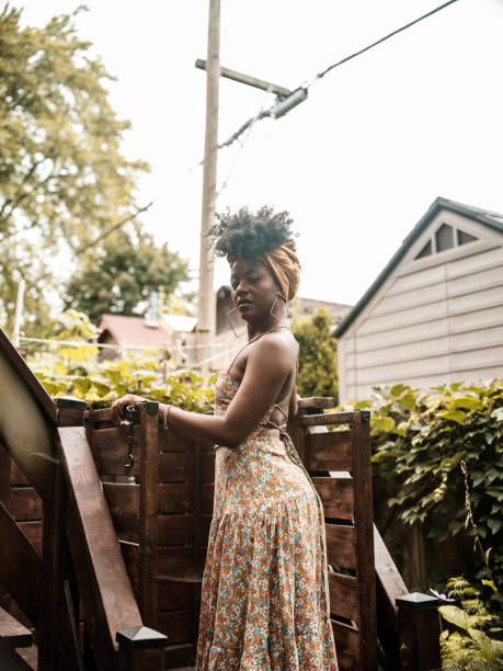 istock Young African woman relaxing in back yard 1333592195