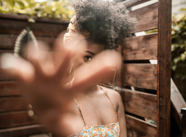 istock Young African woman relaxing in back yard 1333592277