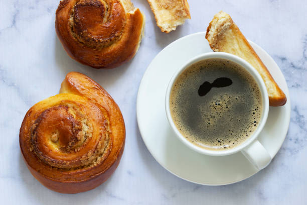 istock Cinnamon rolls with nut filling, served with coffee. 1333592472