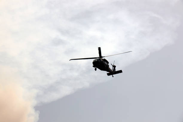 istock Black Hawk uh 60 helicopter rescue team approach landing in forest fire 1333595074