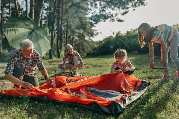 キャンプの多世代家族 - camping family nature tent ストックフォトと画像