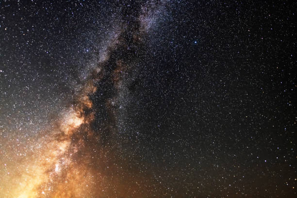 istock Beautiful bright milky way galaxy on the dark sttary sky. Space, astronomical background 1333596342