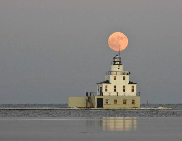 istock A Balancing Act - The full moon over the Manitowoc Lighthouse 1333601062
