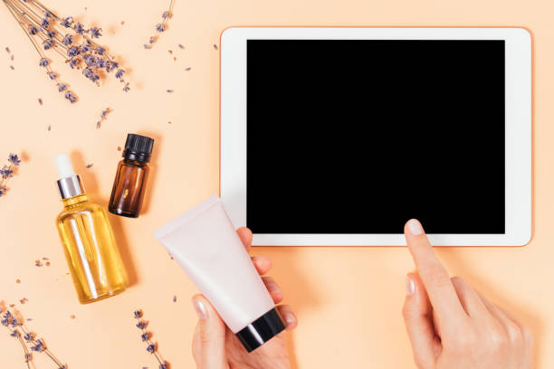 istock Flat lay female hands holding cream tube 1333602969