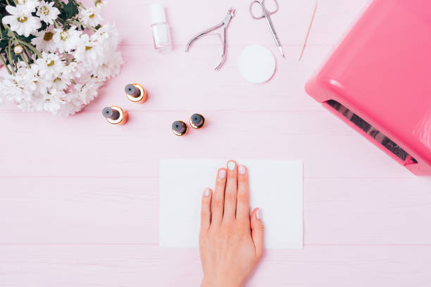 istock Female hand with gel manicure among tools 1333603907