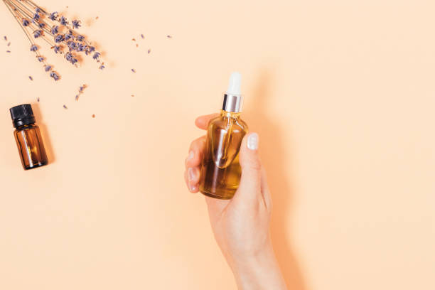 istock Natural lavender oil in female hand 1333603963