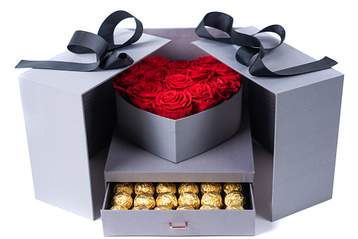 Heart shape box of red roses and chocolate candy from above