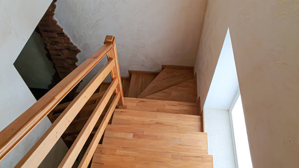 istock Interior items. Wooden staircase, lamp on the wall. 1333607498