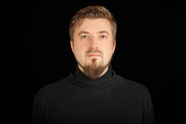 istock Cute bearded young guy in black polo neck sweater. 1333608552