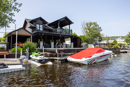 Lac St-Joseph, Quebec, Сanada - August 8, 2021: Luxurious lakefront property located in Lac St-Joseph, a rich suburb of Quebec City on a sunny day of summer.