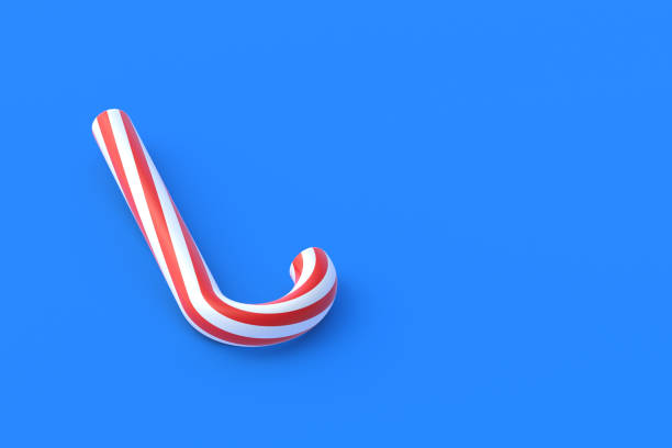 istock Christmas cane, candy with red stripes on blue background. New Years celebration concept. Traditional sweet dessert. Copy space. 3d render 1333610458