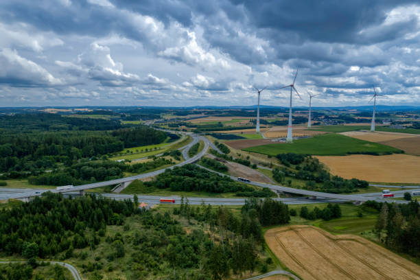 istock highway road interchange with wind turbines (aerial) 1333611856