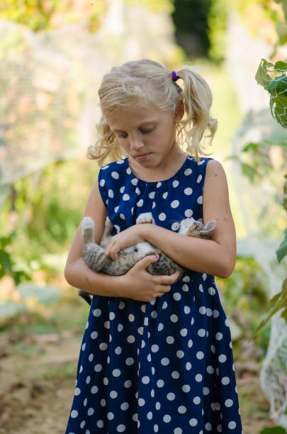 istock happy child and animal cat together 1333612183