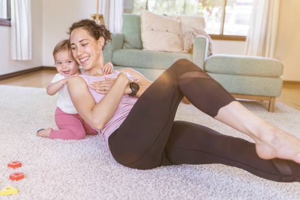 istock Fit Mother Exercising At Home 1333619950