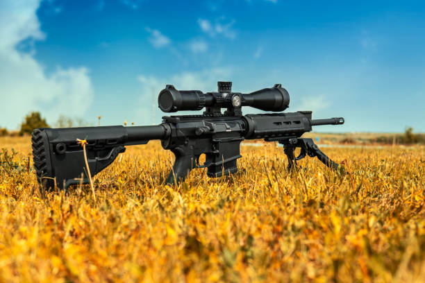 istock Automatic carbine with a telescopic sight. A sniper weapon mounted on a bipod. Gun for long-range aimed shooting. 1333621268