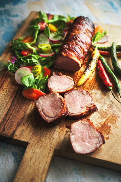 istock Pork Fillet with Bacon and Healthy Salad 1333621380