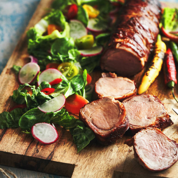 istock Pork Fillet with Bacon and Healthy Salad 1333621520