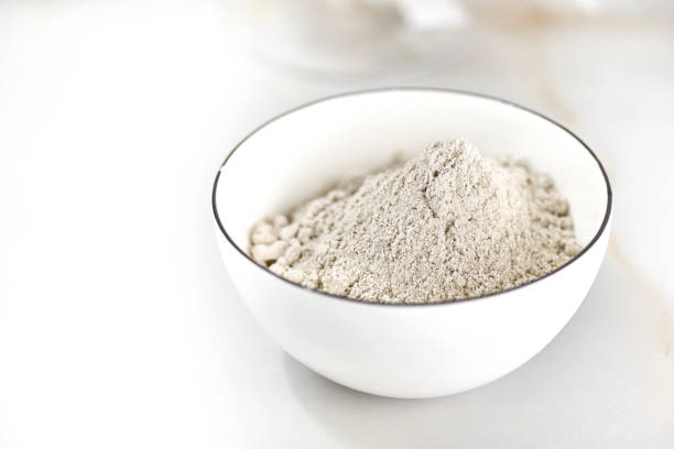 istock bowl of flour on a light table. selective focus 1333621539