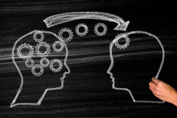 istock Head silhouette and gears with knowledge transfer and education concept 1333623968