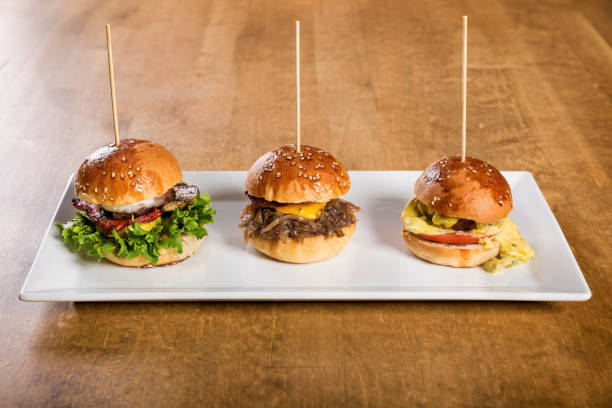 istock Three Small Vegan Burger Served on White Plate for a Snack 1333626549