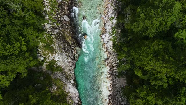 Soca Alpine Mountains River in Slovenia. Aerial View Drone Top Down in Real Time