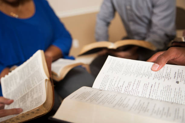 istock Bible Study.  Multi Ethnic Group.Multi Ethnic Group of friends meet for a Bible Study.  Group includes a teenager, young adults, mid-adult and senior adult. 1333641071