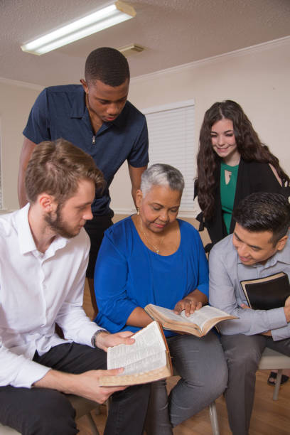 Bible Study.  Multi Ethnic Group.Multi Ethnic Group of friends meet for a Bible Study.  Group includes a teenager, young adults, mid-adult and senior adult.