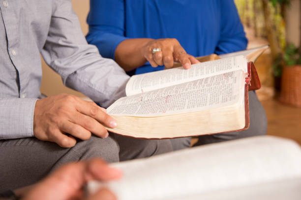 istock Bible Study.  Multi Ethnic Group.Multi Ethnic Group of friends meet for a Bible Study.  Group includes a teenager, young adults, mid-adult and senior adult. 1333641094