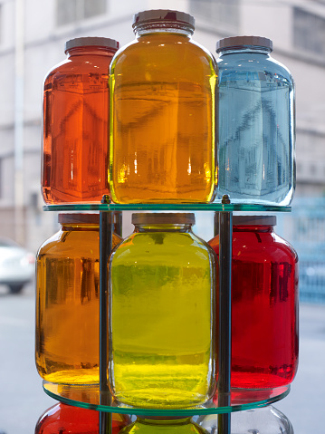 Colorful jars stacked in a shop window
