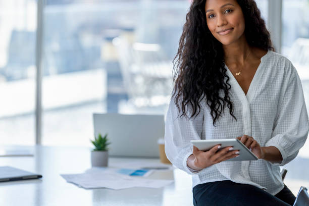 istock Young business woman using a digital tablet. 1333643354