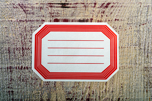 Retro design vintage styled blank rectangle label, red text border. Old style empty white paper sticker with text copy space.