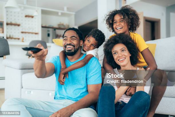 Family Watching Television Stock Photo - Download Image Now - Family, Watching TV, Watching