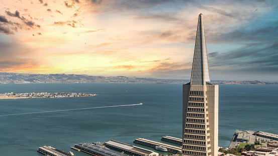 San Francisco, California, USA - August 2019: Transamerica Pyramid with San Francisco bay area during sunset