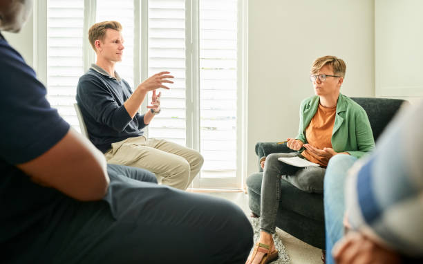 istock Group of people during a mental health session 1333645558