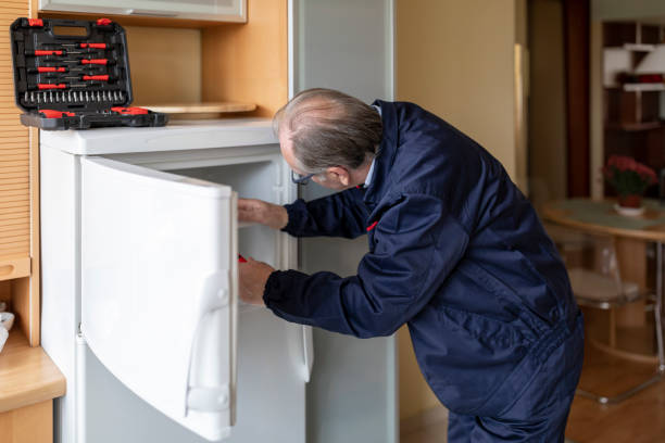 istock An Older Maintenance Engineer is Working in the Kitchen and Repairing the Refrigerator. 1333646510