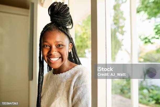 Cheerful African Teenage Girl Coming In Her House Stock Photo - Download Image Now - Teenager, Teenage Girls, African-American Ethnicity