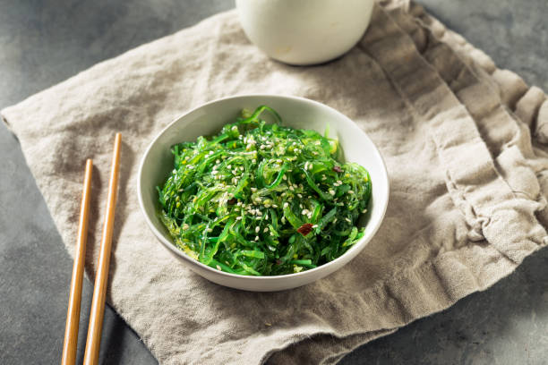 Homemade Healthy Korean Miyeok Muchim Seaweed Salad Homemade Healthy Korean Miyeok Muchim Seaweed Salad with Sesame Seeds banchan stock pictures, royalty-free photos & images