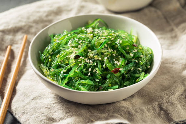 Homemade Healthy Korean Miyeok Muchim Seaweed Salad Homemade Healthy Korean Miyeok Muchim Seaweed Salad with Sesame Seeds banchan stock pictures, royalty-free photos & images