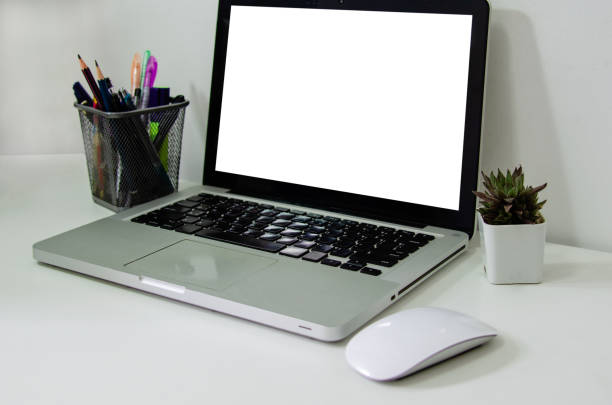 istock Computer laptop mock up blank white and mouse on desk. Used to put text or information to advertise news or sell products online. concept marketing business 1333654518
