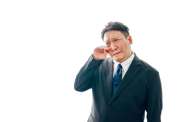 istock Middle-aged men in suits who are terribly sad. 1333666249