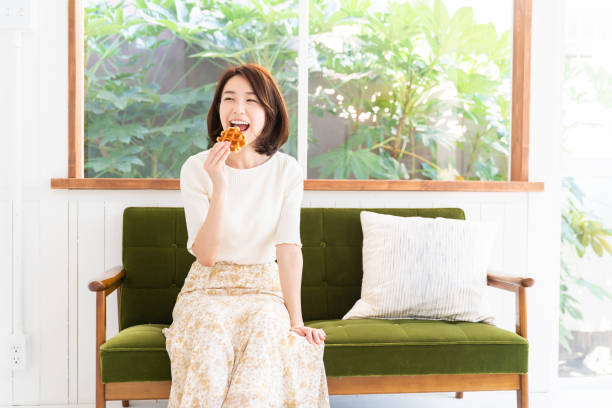 istock attractive asian woman who eats 1333672482