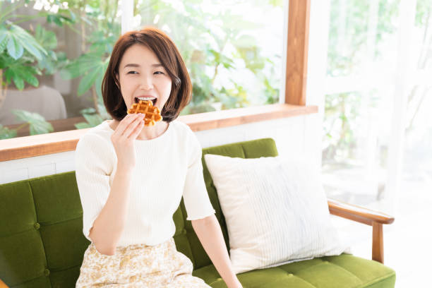 istock attractive asian woman who eats 1333672494