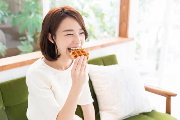 istock attractive asian woman who eats 1333672499