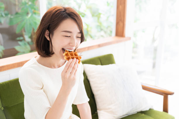 istock attractive asian woman who eats 1333672507