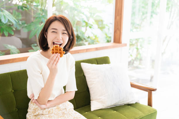 istock attractive asian woman who eats 1333672513