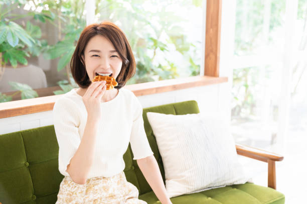 istock attractive asian woman who eats 1333673574